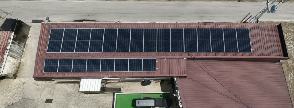 Solar panels mounted across the roof of the Pyong Yu Commercial Complex