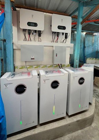 Row of hybrid inverters and battery cabinets ready for installation