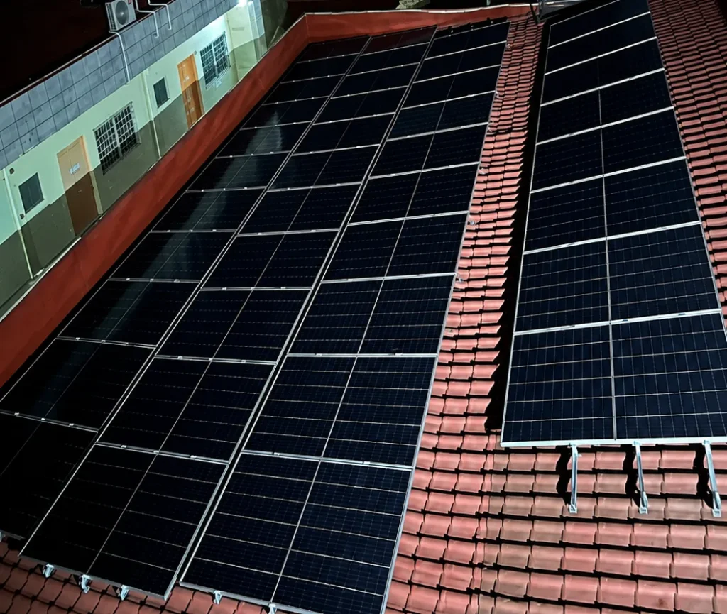 Solar array spanning the red roof of the Red Viper Ventures Corp office