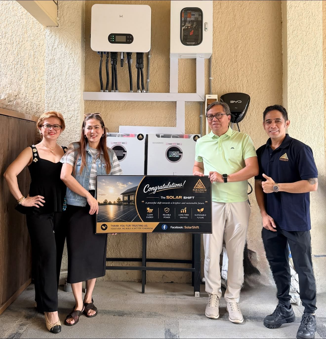 Solar Shift team presenting a plaque at a completed system turnover